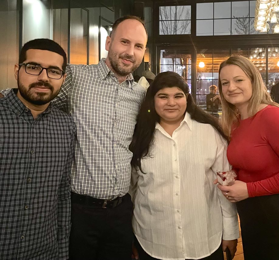 Tanishpreet with colleagues at an evening gathering