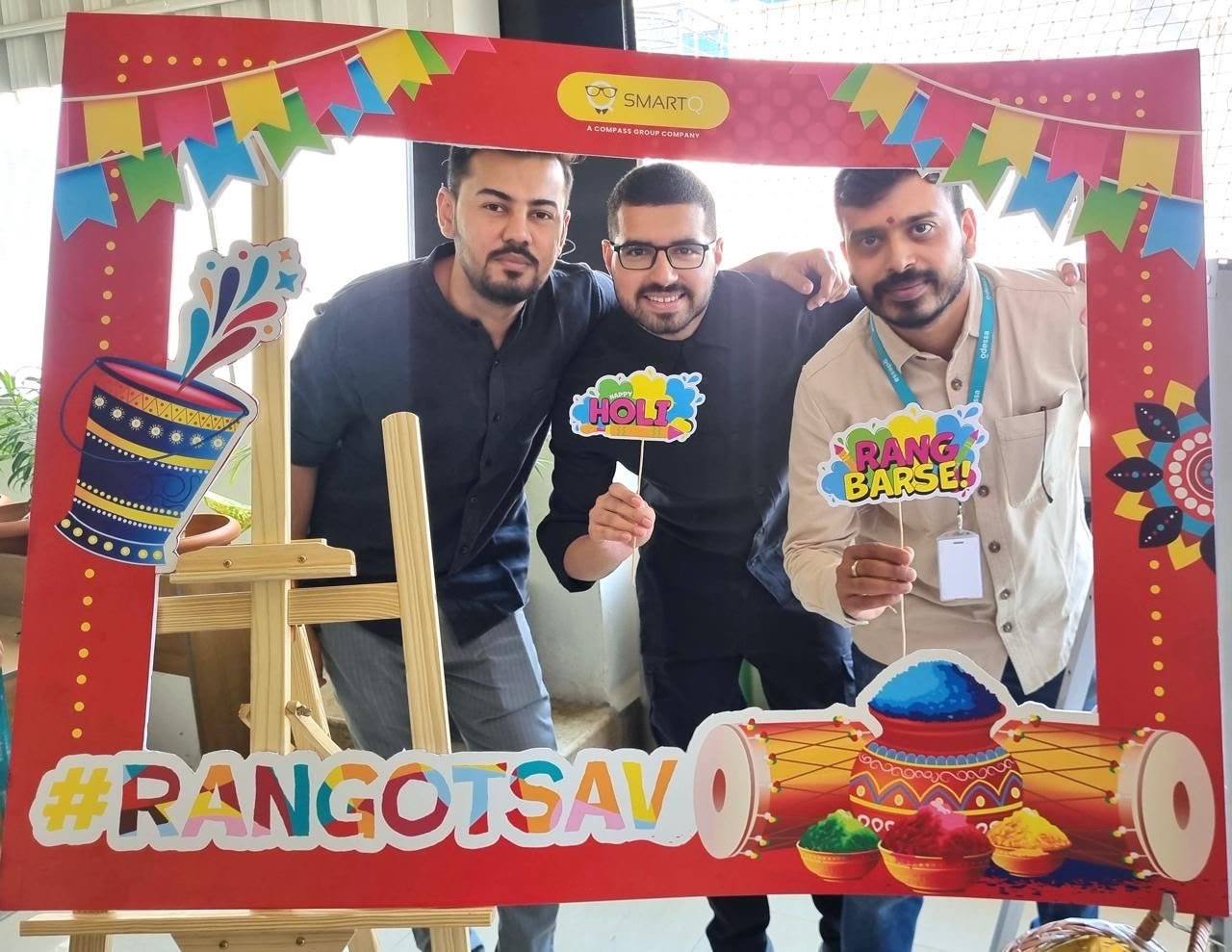 Tanishpreet and colleagues celebrating Holi at the office